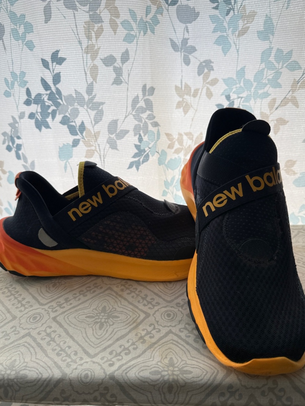 New Balance Men’s Black and Orange Slip-On Sneakers
